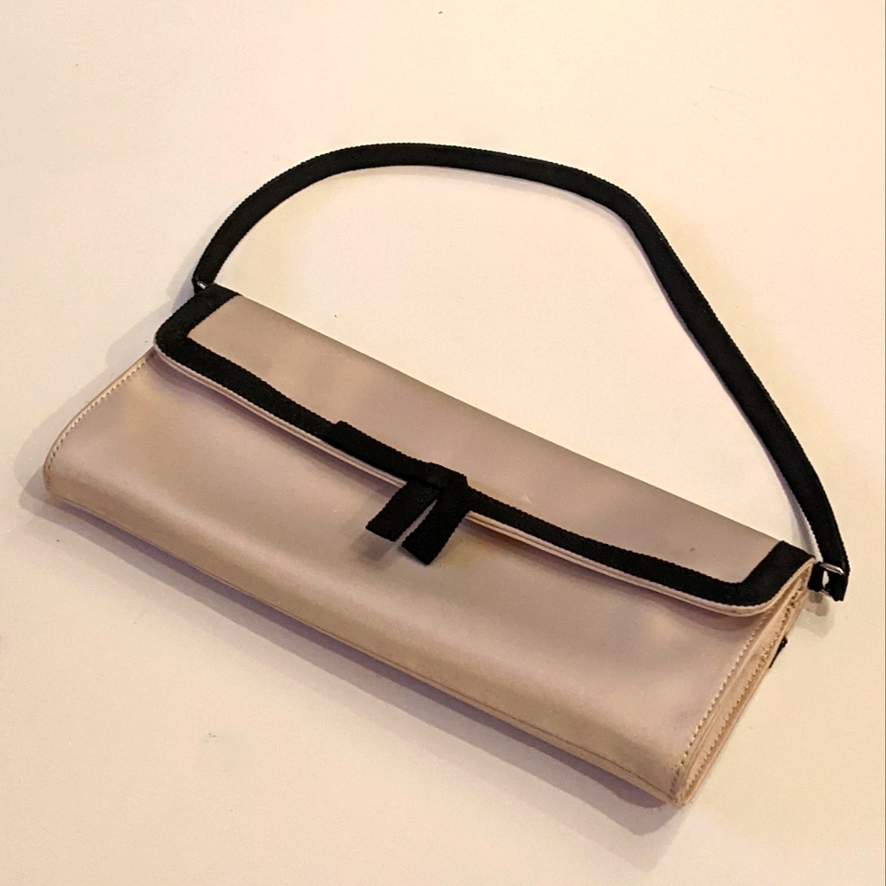 Cream clutch with black ribbon accents, Banana Republic